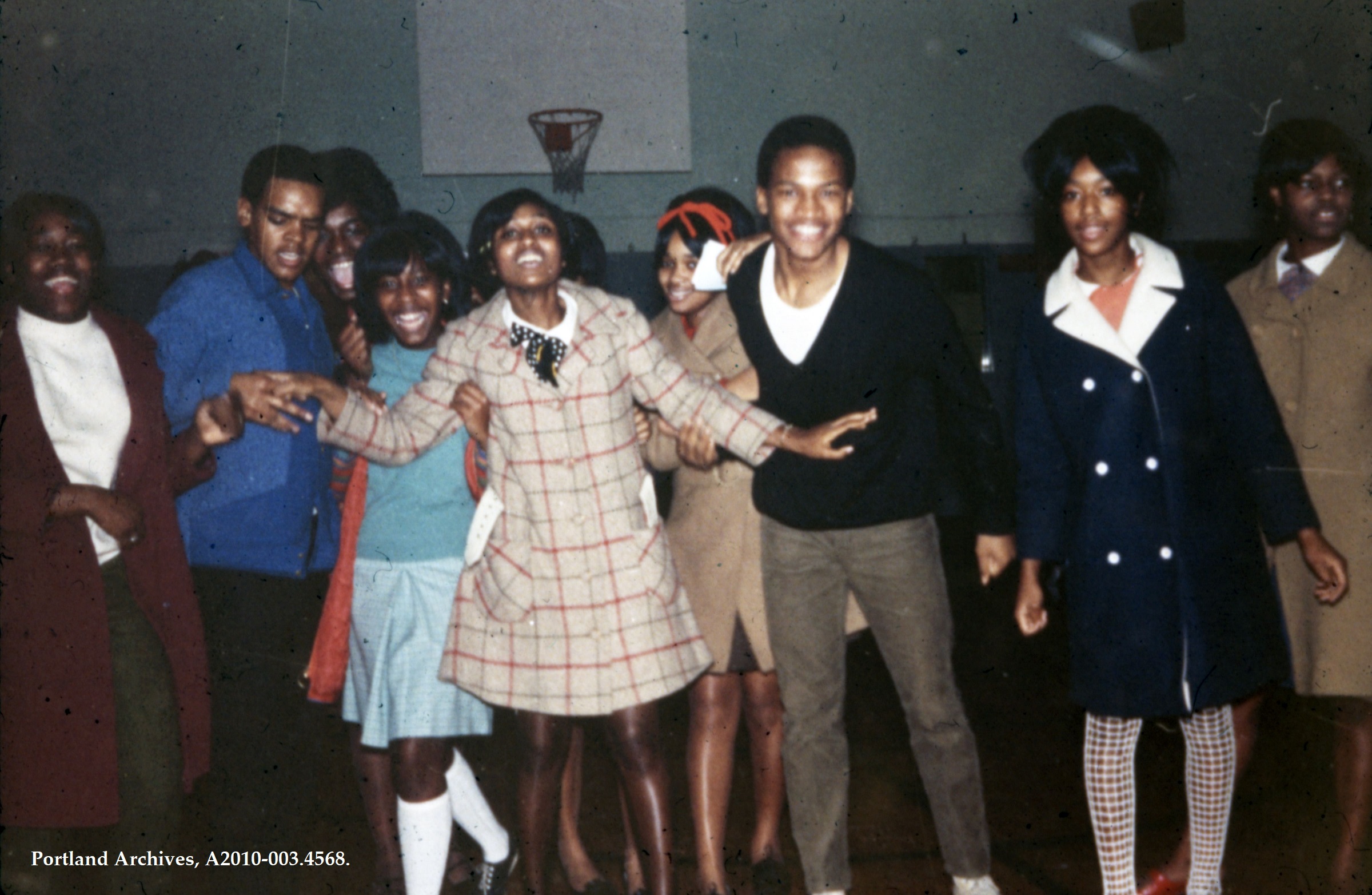 A small group of youth smile and pose for a photo at the Boise-Eliot School for Fun Night, 1968.