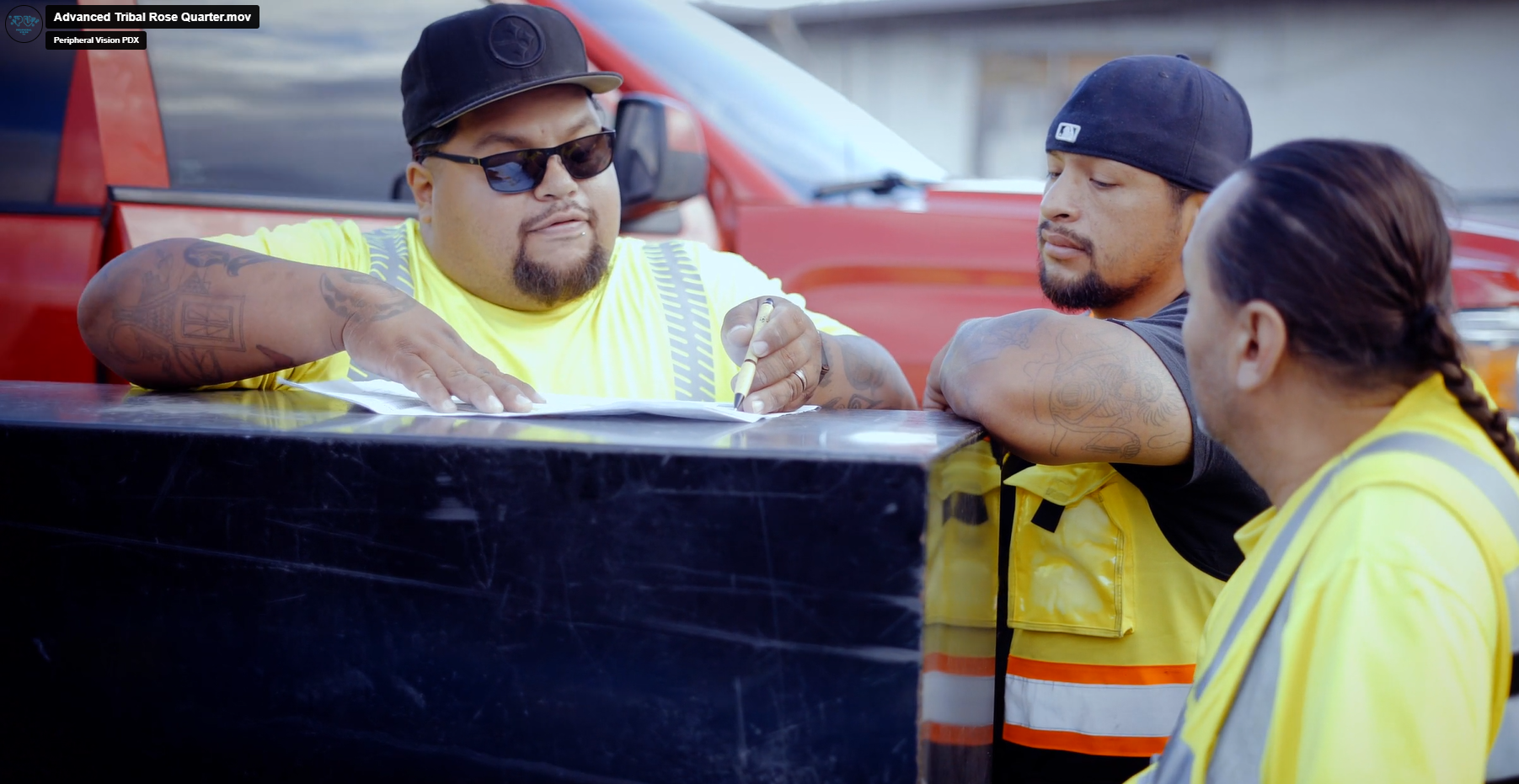 Advanced Tribal team reviews a set of construction plans before heading to a project site.