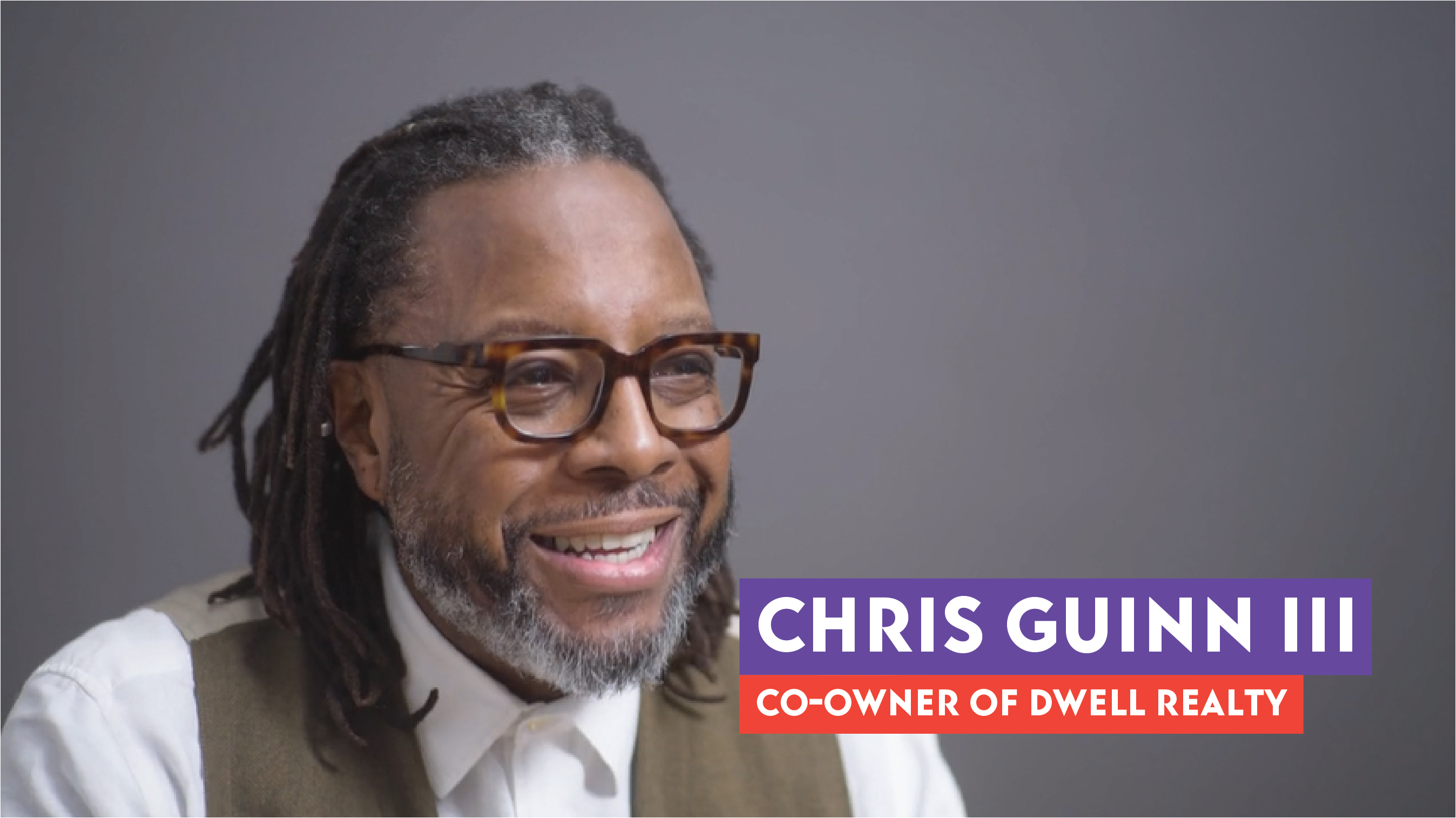 Chris Guinn smiling during his interview in a studio.