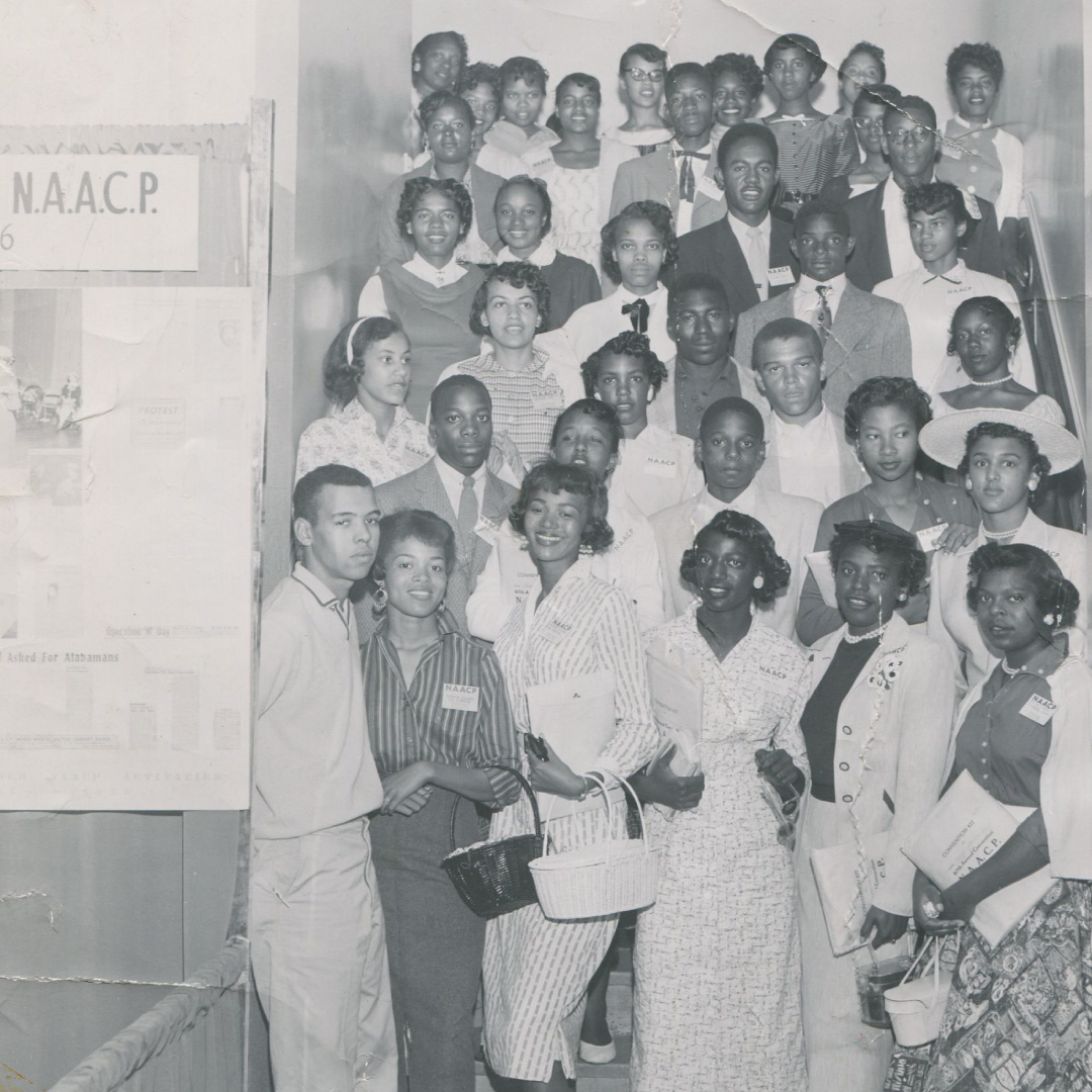 Black and white photograph of a group of teenagers from the NAACP Youth Council in 1956.