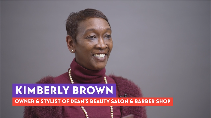 Kimberly Brown smiling during her interview in a studio.